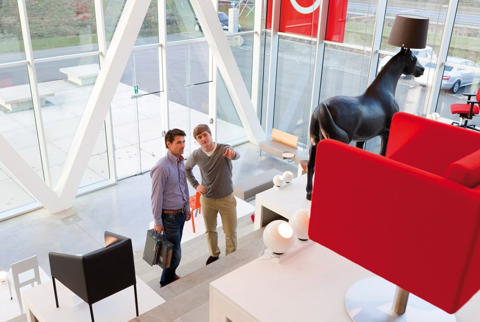 2 men in modern office building entrance area